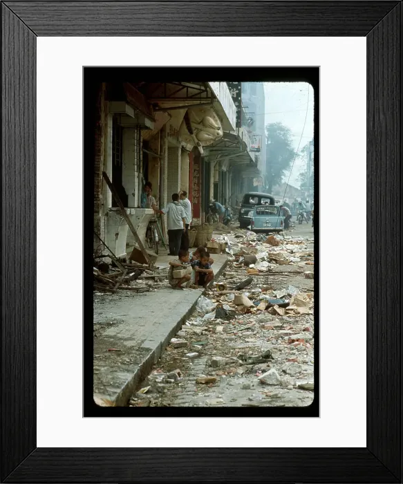 Framed Print : People Sifting Through Rubble in Street