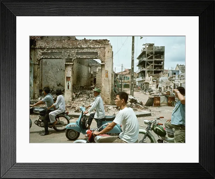Framed Print : Taxis and Moped Pass Flattened Building Framed Print : Taxis and Moped Pass Flattened Building