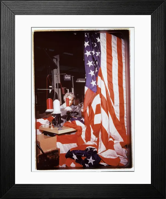 Framed Print : Woman Sewing Stripes on an American Flag Framed Print : Woman Sewing Stripes on an American Flag