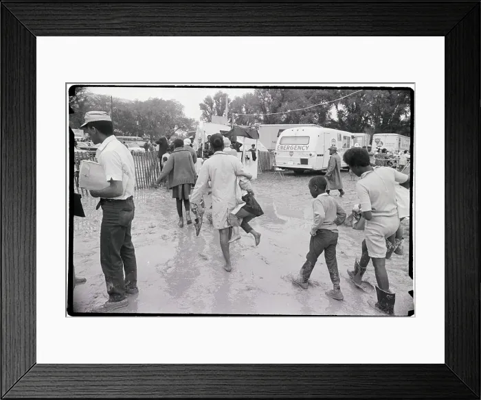 Framed Print : People Walking Through Mud At Camp Site Framed Print : People Walking Through Mud At Camp Site
