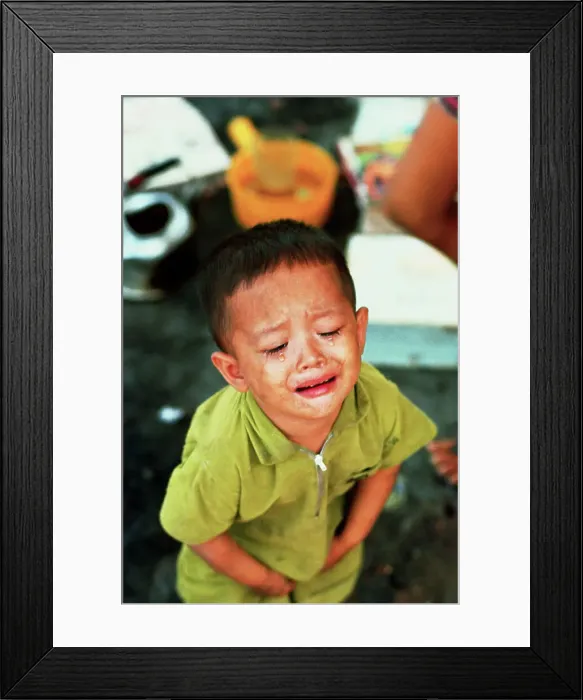 Framed Print : Young Vietnamese Boy Crying Framed Print : Young Vietnamese Boy Crying