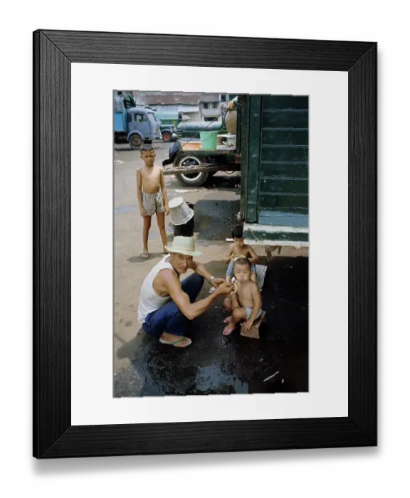 Framed Print : Refugees Sheltering Under Truck Framed Print : Refugees Sheltering Under Truck