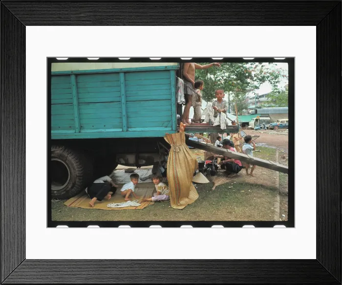 Framed Print : Vietnamese Refugees Using Truck as Shelter Framed Print : Vietnamese Refugees Using Truck as Shelter