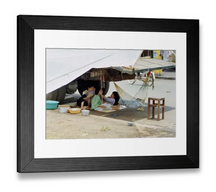 Framed Print : Refugees Sheltering Under Truck Framed Print : Refugees Sheltering Under Truck