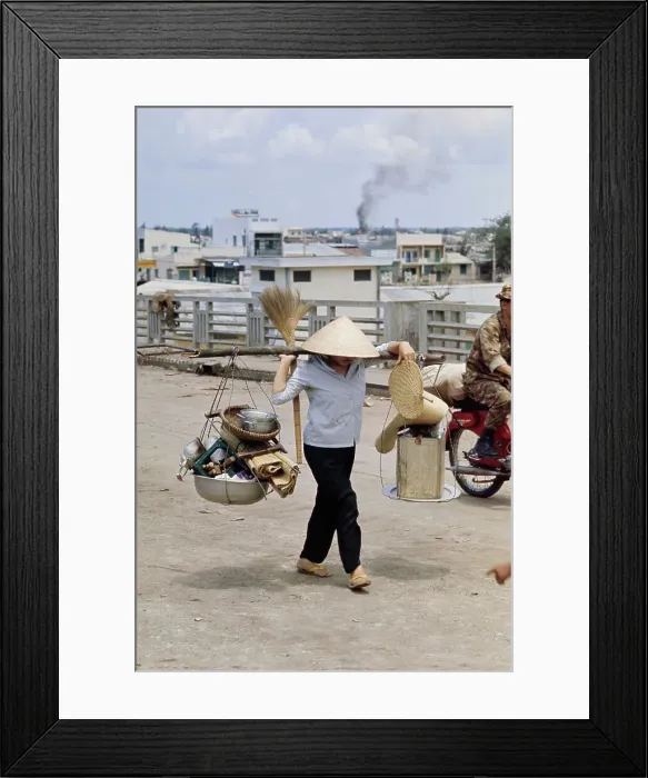 Framed Print : Vietnamese Woman Carrying Belongings Framed Print : Vietnamese Woman Carrying Belongings