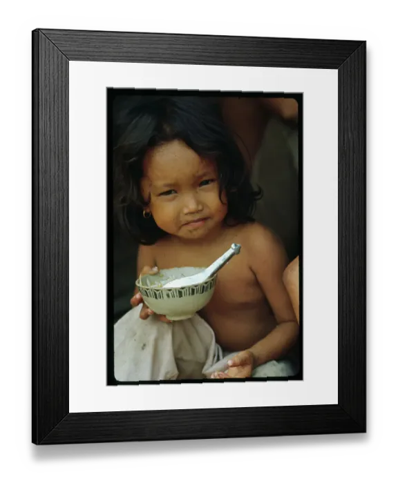 Framed Print : Vietnamese Girl Eating Bowl of Rice Framed Print : Vietnamese Girl Eating Bowl of Rice