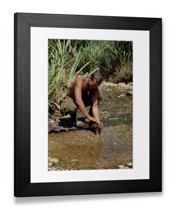Framed Print : Soldier Washing Dog