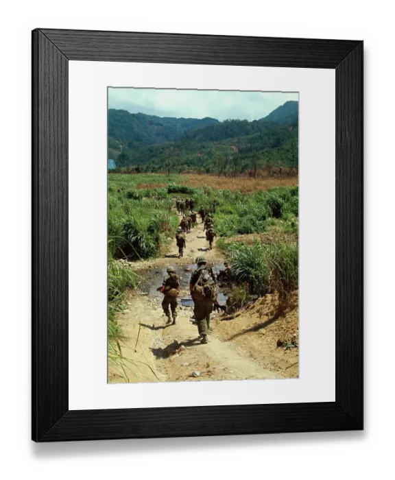 Framed Print : US Soldiers Patrolling a Road in Vietnam Framed Print : US Soldiers Patrolling a Road in Vietnam