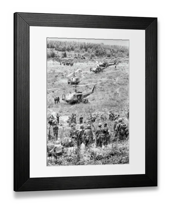 Framed Print : American Soldiers Alighting from Helicopters in Vietnam Field