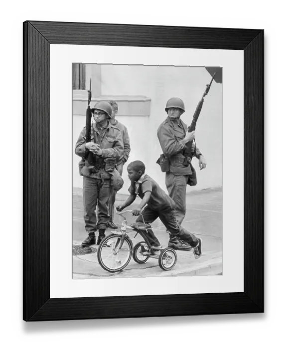 Framed Print : A Child Tricycles Past Federal Troops