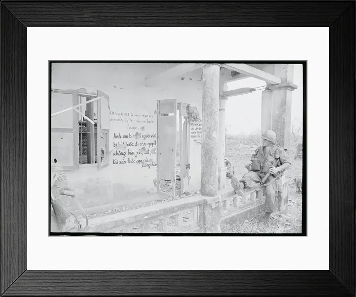 Framed Print : US Soldier Reads a Sign in Hue, S.Vietnam Framed Print : US Soldier Reads a Sign in Hue, S.Vietnam