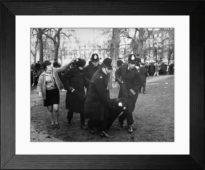 Framed Print : Policemen Carrying Injured Colleague Framed Print : Policemen Carrying Injured Colleague