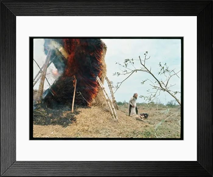 Framed Print : Woman Standing Next to a Burning Structure Framed Print : Woman Standing Next to a Burning Structure