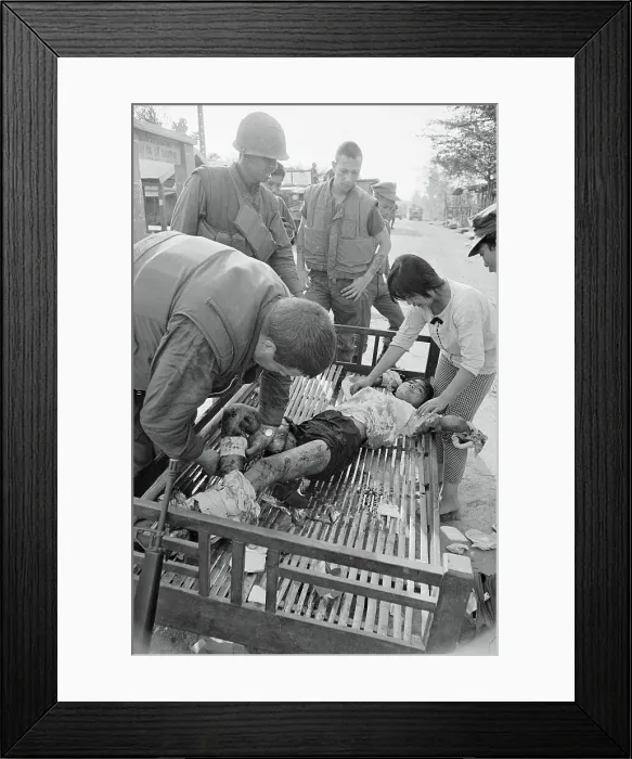Framed Print : Medic Binding a Child's Wounds Framed Print : Medic Binding a Child's Wounds