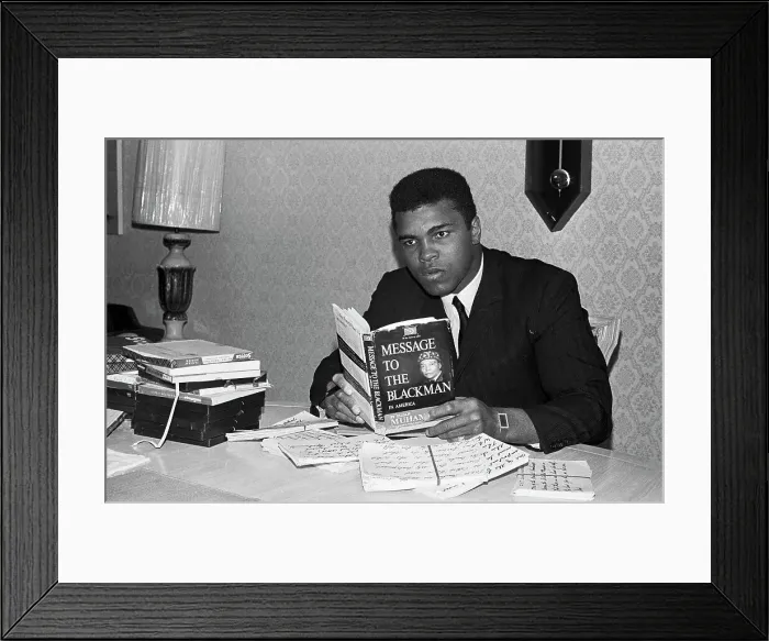 Framed Print : Muhammad Ali Reading a Book Framed Print : Muhammad Ali Reading a Book