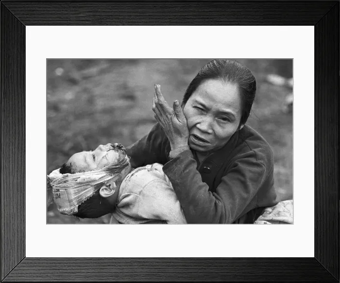 Framed Print : Distraught Vietnamese Woman Holding Child Framed Print : Distraught Vietnamese Woman Holding Child