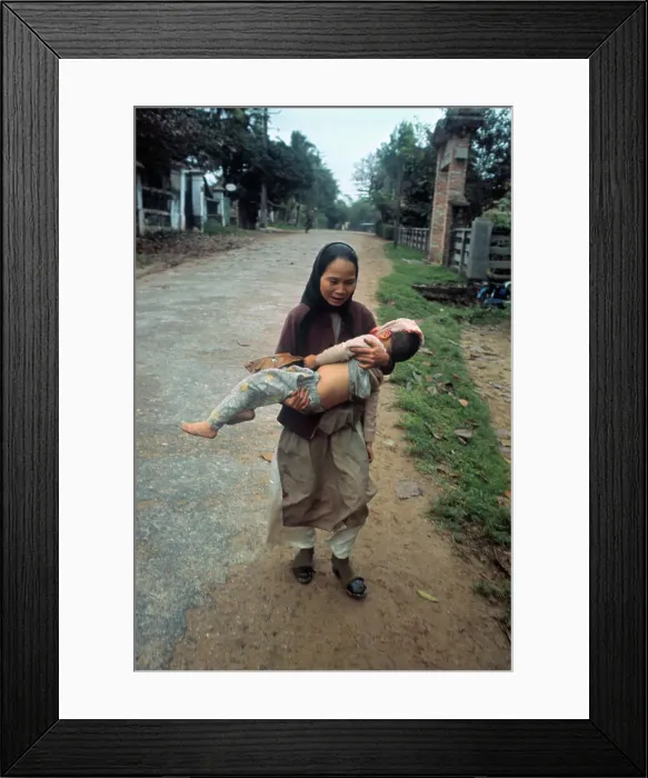Framed Print : South Vietnamese Woman Carrying Her Wounded Son Framed Print : South Vietnamese Woman Carrying Her Wounded Son