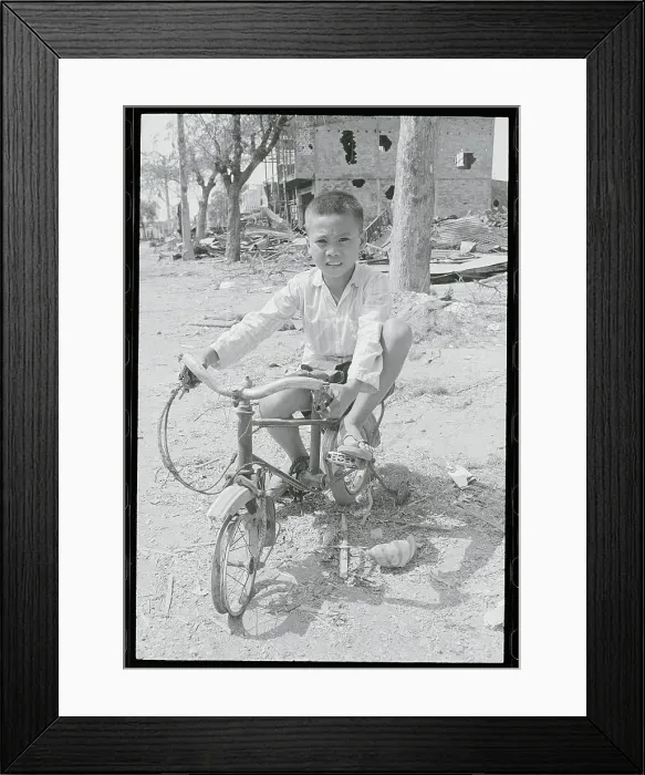 Framed Print : Vietnamese Boy on His Destroyed Bicycle
