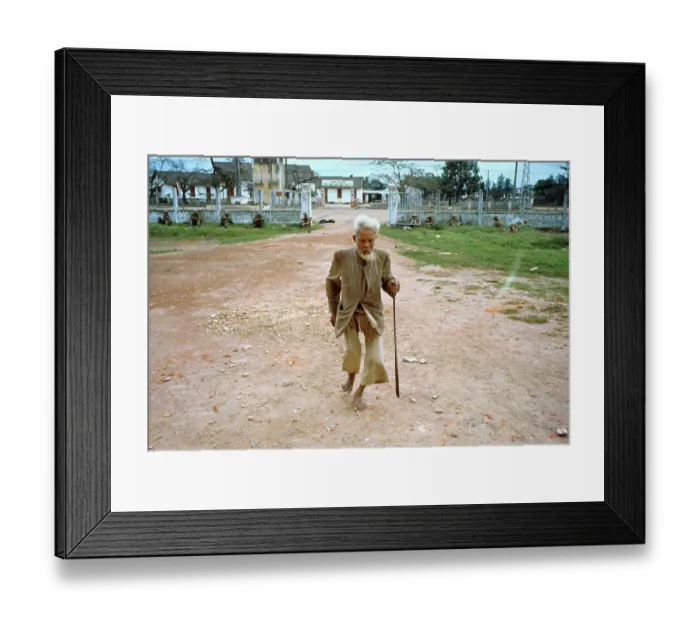 Framed Print : Vietnamese Man Walking with US Marines at Wall