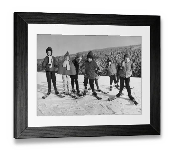 Framed Print : Children Learning to Move on Skis
