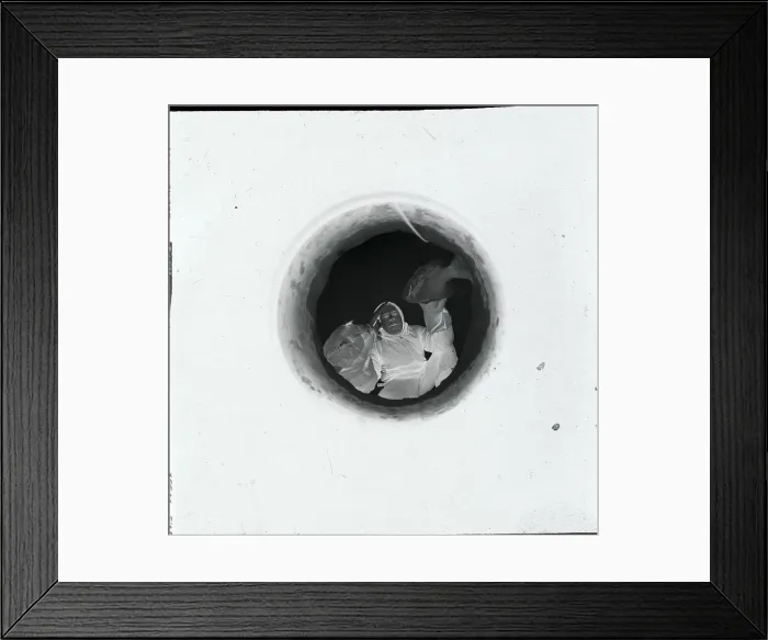 Framed Print : Student Removing Fish from Hole Framed Print : Student Removing Fish from Hole