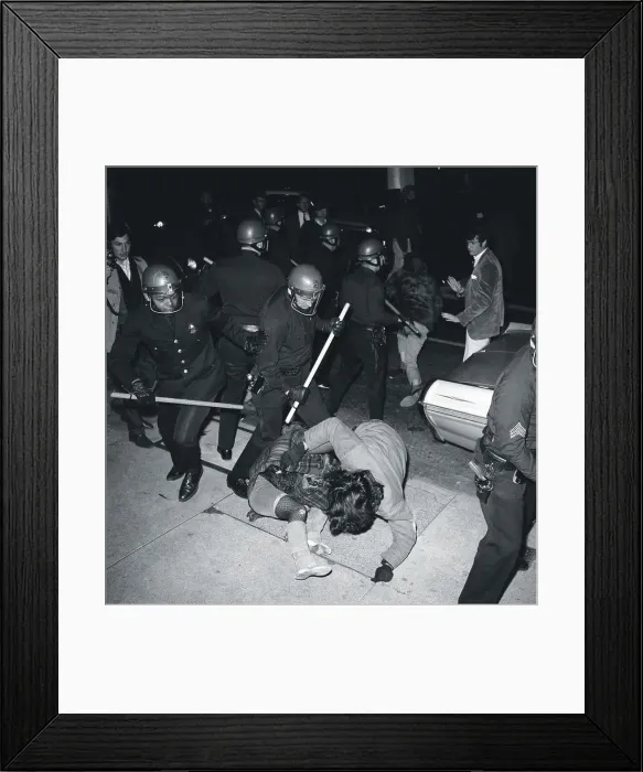 Framed Print : Policeman with Sticks Beating Protesters Framed Print : Policeman with Sticks Beating Protesters