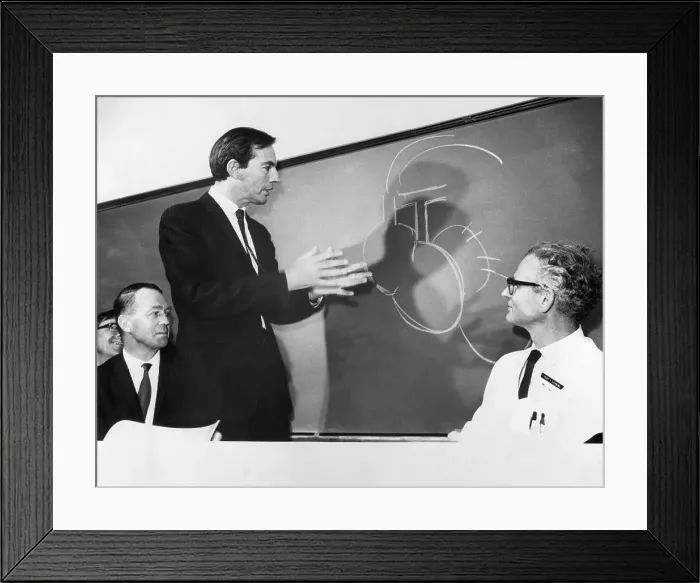 Framed Print : Christian Barnard Gesturing at Chalkboard Framed Print : Christian Barnard Gesturing at Chalkboard