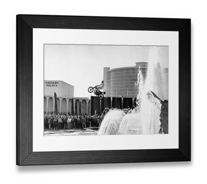 Framed Print : Evel Knievel Jumping Motorcycle over Fountain Framed Print : Evel Knievel Jumping Motorcycle over Fountain