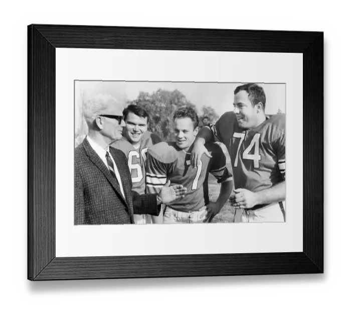Framed Print : College Football Players Talking with Former Coach Framed Print : College Football Players Talking with Former Coach
