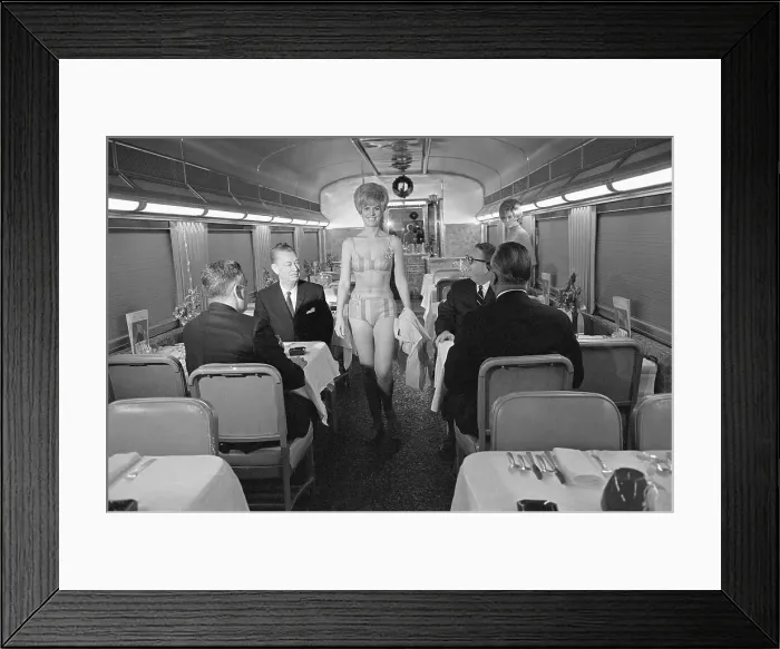 Framed Print : Woman in Bikini Walks Down Train Aisle Framed Print : Woman in Bikini Walks Down Train Aisle