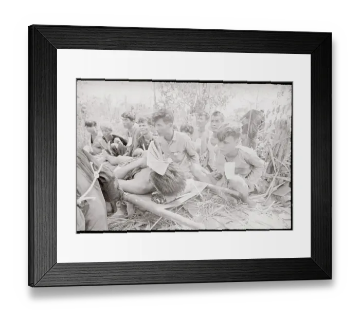 Framed Print : Viet Cong Captives Standing by Injured Framed Print : Viet Cong Captives Standing by Injured