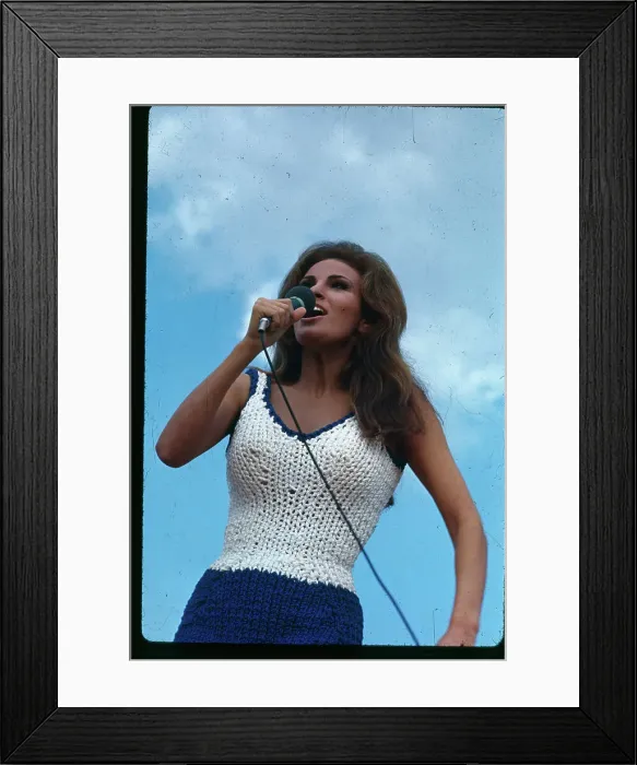 Framed Print : Raquel Welch Using a Microphone