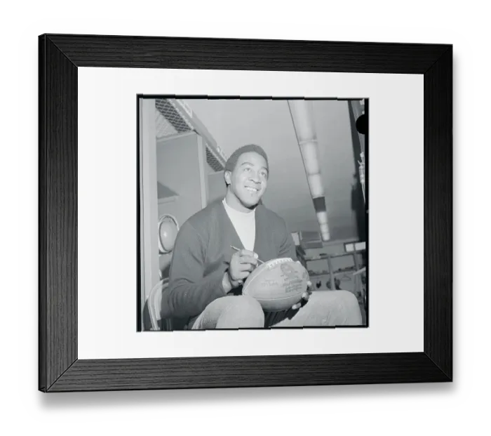 Framed Print : Leroy Kelly Autographing a Football Framed Print : Leroy Kelly Autographing a Football