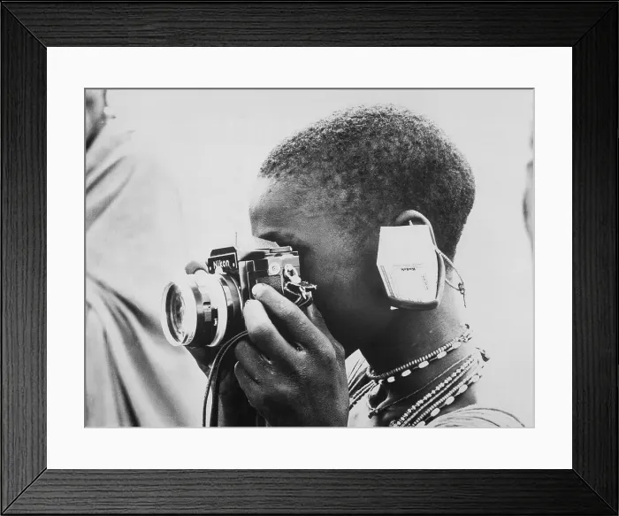 Framed Print : Woman Looking Through a Camera Framed Print : Woman Looking Through a Camera