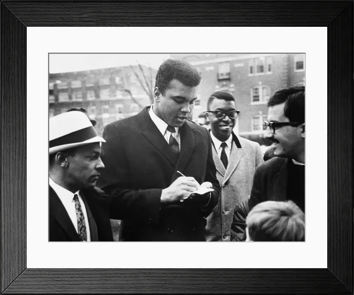 Framed Print : Cassius Clay Signs Autographs Framed Print : Cassius Clay Signs Autographs