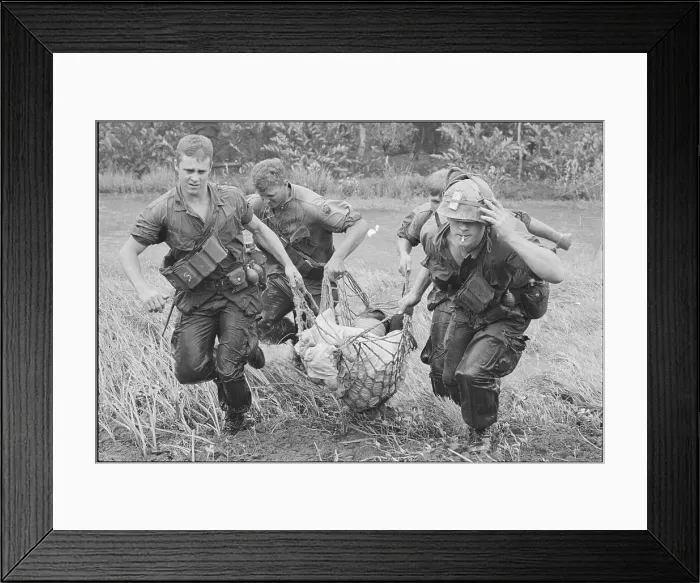 Framed Print : American Soldiers Carrying Wounded Civilian in Vietnam Framed Print : American Soldiers Carrying Wounded Civilian in Vietnam
