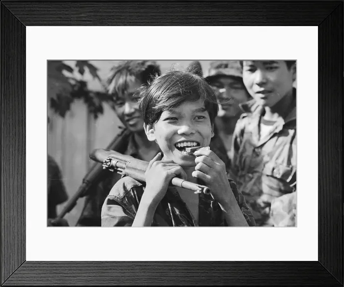 Framed Print : Young Soldier Eating a Candy Bar Framed Print : Young Soldier Eating a Candy Bar