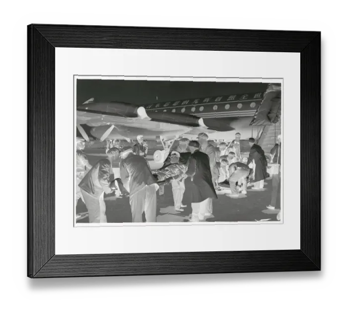 Framed Print : Men Carrying Wounded Diplomats Towards Aircraft Framed Print : Men Carrying Wounded Diplomats Towards Aircraft