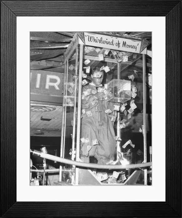 Framed Print : Man Playing Whirlwind of Money Framed Print : Man Playing Whirlwind of Money