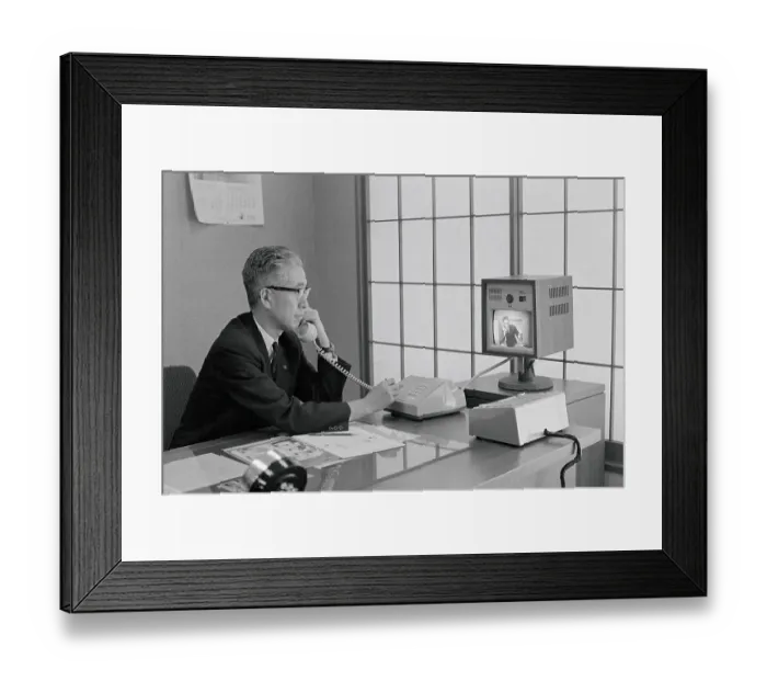 Framed Print : Talking on a Videophone