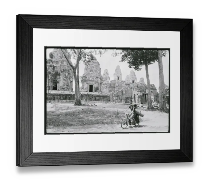 Framed Print : Cyclists Pictured Riding Through the Bayon Framed Print : Cyclists Pictured Riding Through the Bayon
