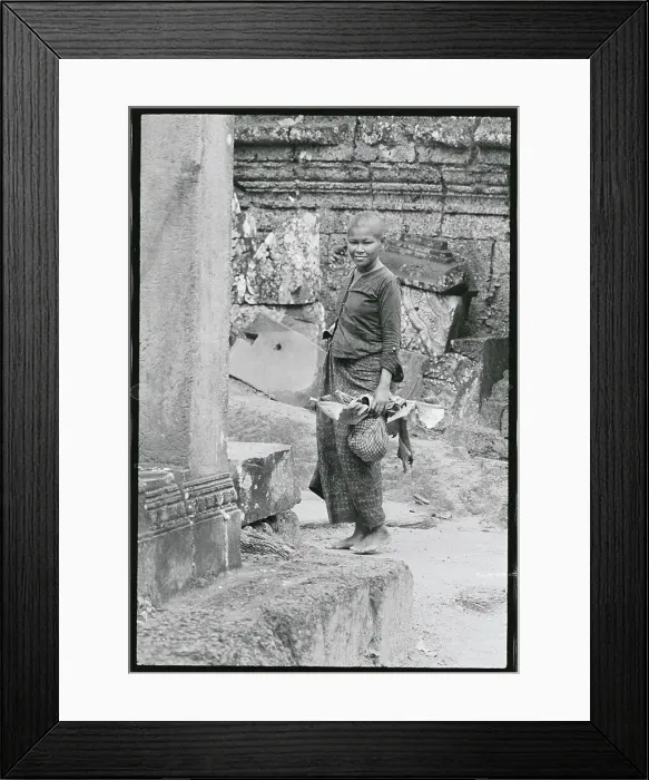 Framed Print : Woman Making Her Way Through the Bayon Framed Print : Woman Making Her Way Through the Bayon