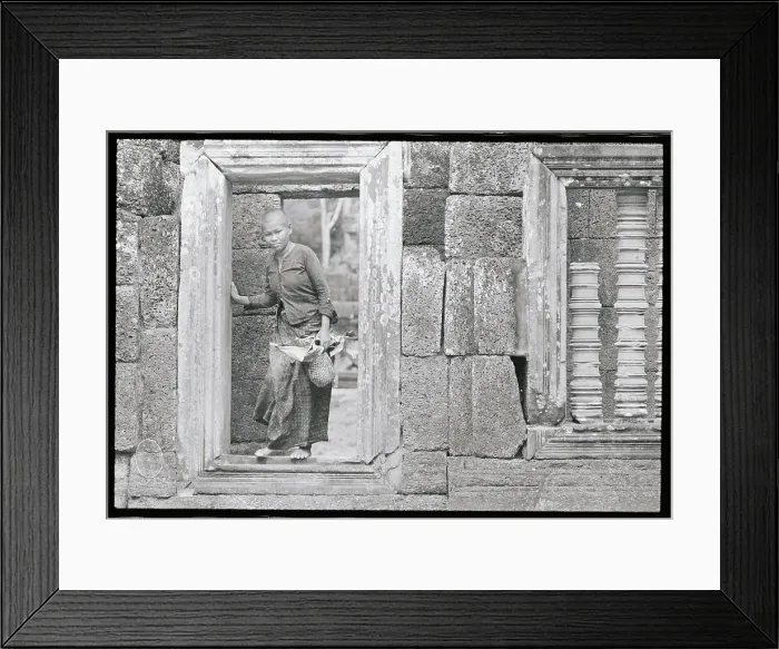 Framed Print : Woman Making Her Way Through the Bayon Framed Print : Woman Making Her Way Through the Bayon