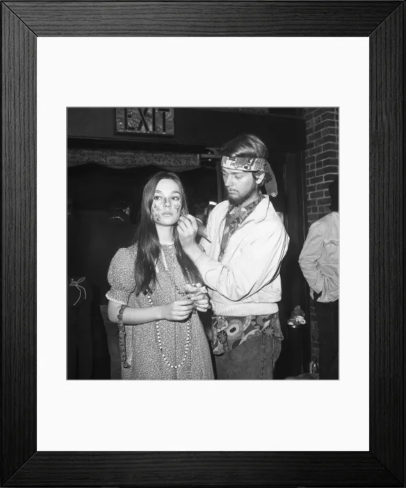 Framed Print : Hippie Woman Getting Her Face Painted Framed Print : Hippie Woman Getting Her Face Painted
