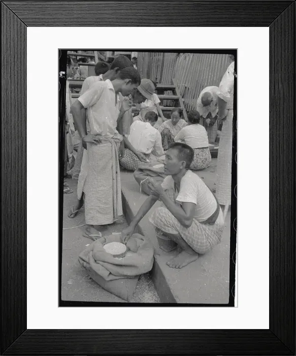 Framed Print : Man Inspecting Rice in Market Framed Print : Man Inspecting Rice in Market