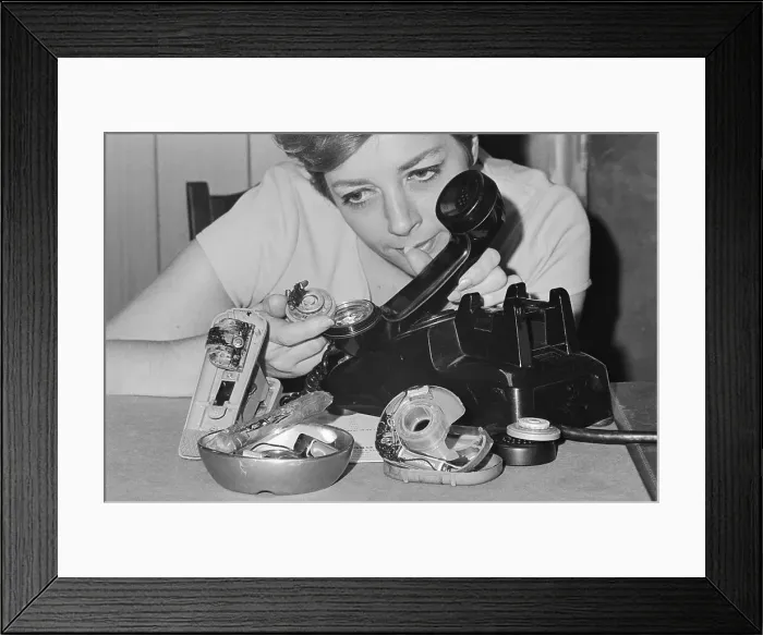 Framed Print : Woman Showing Bugged Office Equipment