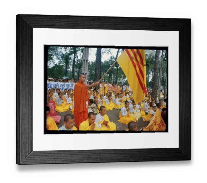 Framed Print : Buddhist Monk Holding a Flag Framed Print : Buddhist Monk Holding a Flag