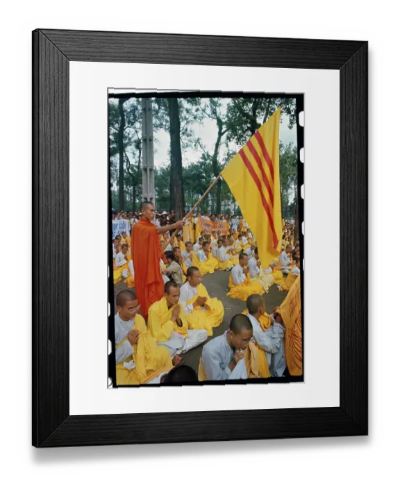 Framed Print : Buddhist Monk Holding a Flag Framed Print : Buddhist Monk Holding a Flag