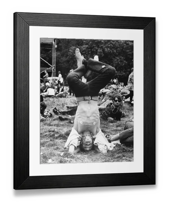 Framed Print : Male Flower Child Standing On Head Framed Print : Male Flower Child Standing On Head