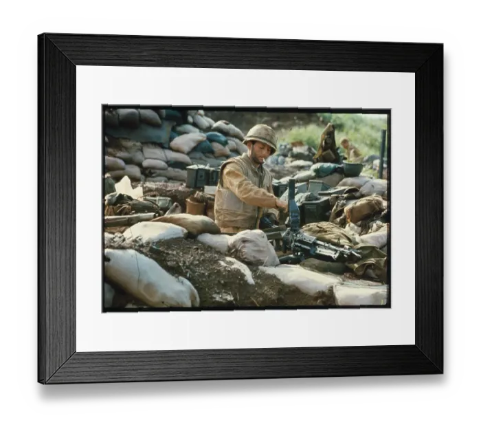 Framed Print : U.S. Marine Looking at Machine Gun
